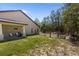 Inviting backyard featuring a covered porch swing, serene views, and a fenced pasture at 12090 Thames Ave, Weeki Wachee, FL 34614