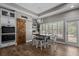 Bright and airy dining area with a stylish barn door, modern lighting, and plantation shutters at 12090 Thames Ave, Weeki Wachee, FL 34614