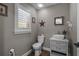 Stylishly decorated half bathroom featuring a vessel sink, modern fixtures, and neutral tones at 12090 Thames Ave, Weeki Wachee, FL 34614