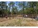 Fenced pasture area with mature trees, livestock, and secure perimeter fencing at 12090 Thames Ave, Weeki Wachee, FL 34614