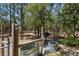 Fenced pasture area featuring livestock troughs, perfect for raising animals at 12090 Thames Ave, Weeki Wachee, FL 34614