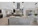 Modern kitchen featuring stainless steel hood, granite counters, and eat-in breakfast nook at 12838 Tallowood Dr, Riverview, FL 33579