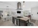 Modern kitchen with stainless steel appliances, granite countertops, and an open floor plan at 12838 Tallowood Dr, Riverview, FL 33579