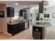 Modern kitchen with granite countertops, stainless steel appliances, and sleek black cabinetry at 12838 Tallowood Dr, Riverview, FL 33579