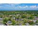 An aerial view of the property with nearby golf course and lake views at 1290 Michigan Blvd, Dunedin, FL 34698