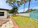 Spacious backyard features a charming gazebo and storage shed at 1290 Michigan Blvd, Dunedin, FL 34698