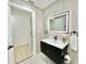 Modern bathroom with floating vanity, sleek fixtures, and illuminated mirror at 1290 Michigan Blvd, Dunedin, FL 34698