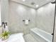 Bright bathroom featuring a bathtub and minimalist design at 1290 Michigan Blvd, Dunedin, FL 34698