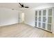 Spacious bedroom features hardwood floors, a ceiling fan, and closet at 1290 Michigan Blvd, Dunedin, FL 34698