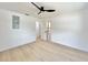 Spacious bedroom with white walls and a modern ceiling fan at 1290 Michigan Blvd, Dunedin, FL 34698