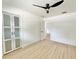 Bright bedroom featuring ample closet space and modern fan at 1290 Michigan Blvd, Dunedin, FL 34698