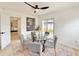 Dining room with glass table, seating for four, and a view to the outdoor space offers a great place to dine at 1290 Michigan Blvd, Dunedin, FL 34698