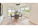 Bright dining area with a glass-top table, comfortable seating, and natural light offers a great space at 1290 Michigan Blvd, Dunedin, FL 34698