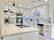 Contemporary kitchen with stainless steel appliances, a center island, and ample cabinet space at 1290 Michigan Blvd, Dunedin, FL 34698