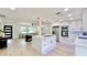 Modern kitchen featuring a center island and stainless steel appliances, open to the living room at 1290 Michigan Blvd, Dunedin, FL 34698