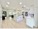 Bright and modern kitchen with a large island, stainless steel appliances, and an open-concept design at 1290 Michigan Blvd, Dunedin, FL 34698