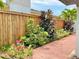 Landscaping with lush plants and privacy fence creates a tranquil outdoor space at 1290 Michigan Blvd, Dunedin, FL 34698