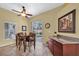 Cozy dining area with table, chairs, and view of the outdoor pool at 137 Woodcreek E Dr, Safety Harbor, FL 34695