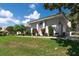 Exterior of the home with lovely landscaping and curb appeal at 137 Woodcreek E Dr, Safety Harbor, FL 34695