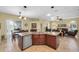 Spacious kitchen with center island, stainless steel dishwasher and view to the living room at 137 Woodcreek E Dr, Safety Harbor, FL 34695
