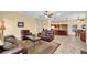Comfortable living room featuring tile floors and an open floor plan, connecting to the kitchen and other living spaces at 137 Woodcreek E Dr, Safety Harbor, FL 34695