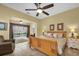 Spacious bedroom with a ceiling fan and view of the pool at 137 Woodcreek E Dr, Safety Harbor, FL 34695