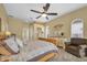 Serene bedroom with a ceiling fan, and natural lighting at 137 Woodcreek E Dr, Safety Harbor, FL 34695