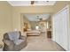 Large bedroom with seating area and neutral color palette at 137 Woodcreek E Dr, Safety Harbor, FL 34695
