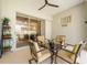 Charming covered patio area provides a tranquil spot for outdoor dining and enjoying the serene backyard setting at 137 Woodcreek E Dr, Safety Harbor, FL 34695