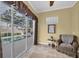 Bright sitting area next to the pool area at 137 Woodcreek E Dr, Safety Harbor, FL 34695