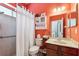 Colorful bathroom featuring a shower-tub combo, vanity, and decorative shelving at 16039 Ternglade Dr, Lithia, FL 33547