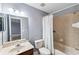 Full bathroom with a shower-tub combo, neutral wall color, and a vanity with an updated faucet at 16039 Ternglade Dr, Lithia, FL 33547