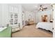 Light, bright bedroom with neutral decor and a ceiling fan at 16039 Ternglade Dr, Lithia, FL 33547