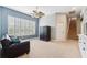Bonus room featuring an entertainment space, a staircase and natural light from the large window at 16039 Ternglade Dr, Lithia, FL 33547
