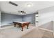 Carpeted bonus room featuring a billiard table, ceiling fan, and neutral color palette at 16039 Ternglade Dr, Lithia, FL 33547