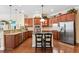 Spacious kitchen featuring stainless steel appliances, granite countertops, and ample cabinet space for storage at 16039 Ternglade Dr, Lithia, FL 33547