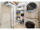 Well-organized laundry room with shelving and storage options, plus front loading washer and dryer at 16039 Ternglade Dr, Lithia, FL 33547