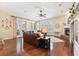 Bright and airy living room with hardwood floors, a fireplace, and sliding glass doors to the outside at 16039 Ternglade Dr, Lithia, FL 33547