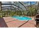 Backyard pool features screened enclosure, brick pool deck, and a relaxing place to enjoy the sun at 16039 Ternglade Dr, Lithia, FL 33547