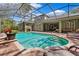 Screened-in pool with brick pavers and covered outdoor dining area; great for entertaining at 16039 Ternglade Dr, Lithia, FL 33547