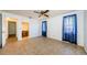 Bright bedroom with tile flooring, 2 windows, with a view of the en-suite bathroom at 1648 Concord St, Dunedin, FL 34698