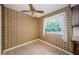 Bright dining area featuring neutral tile flooring and window views to lush outdoor greenery at 1648 Concord St, Dunedin, FL 34698