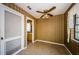 Dining area featuring custom walls and a ceiling fan at 1648 Concord St, Dunedin, FL 34698