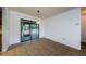 Neutral tile flooring dining room featuring sliding glass doors to the outside patio at 1648 Concord St, Dunedin, FL 34698