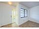 Bright entryway featuring neutral tile flooring and a window for natural light at 1648 Concord St, Dunedin, FL 34698