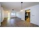 Open-concept living and dining area with neutral tile flooring and bright natural light at 1648 Concord St, Dunedin, FL 34698