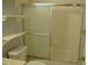 Bathroom featuring a shower with sliding glass doors, enhancing convenience and style at 1665 Grove St, Clearwater, FL 33755