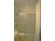 Bathroom featuring a shower with sliding glass doors, creating a convenient and modern space at 1665 Grove St, Clearwater, FL 33755