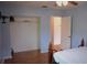 Spacious bedroom features a closet, ceiling fan, and an open door, enhancing the room's appeal and accessibility at 1665 Grove St, Clearwater, FL 33755