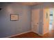 Comfortable bedroom featuring a mounted whiteboard and a convenient door, enhancing the room's appeal and functionality at 1665 Grove St, Clearwater, FL 33755